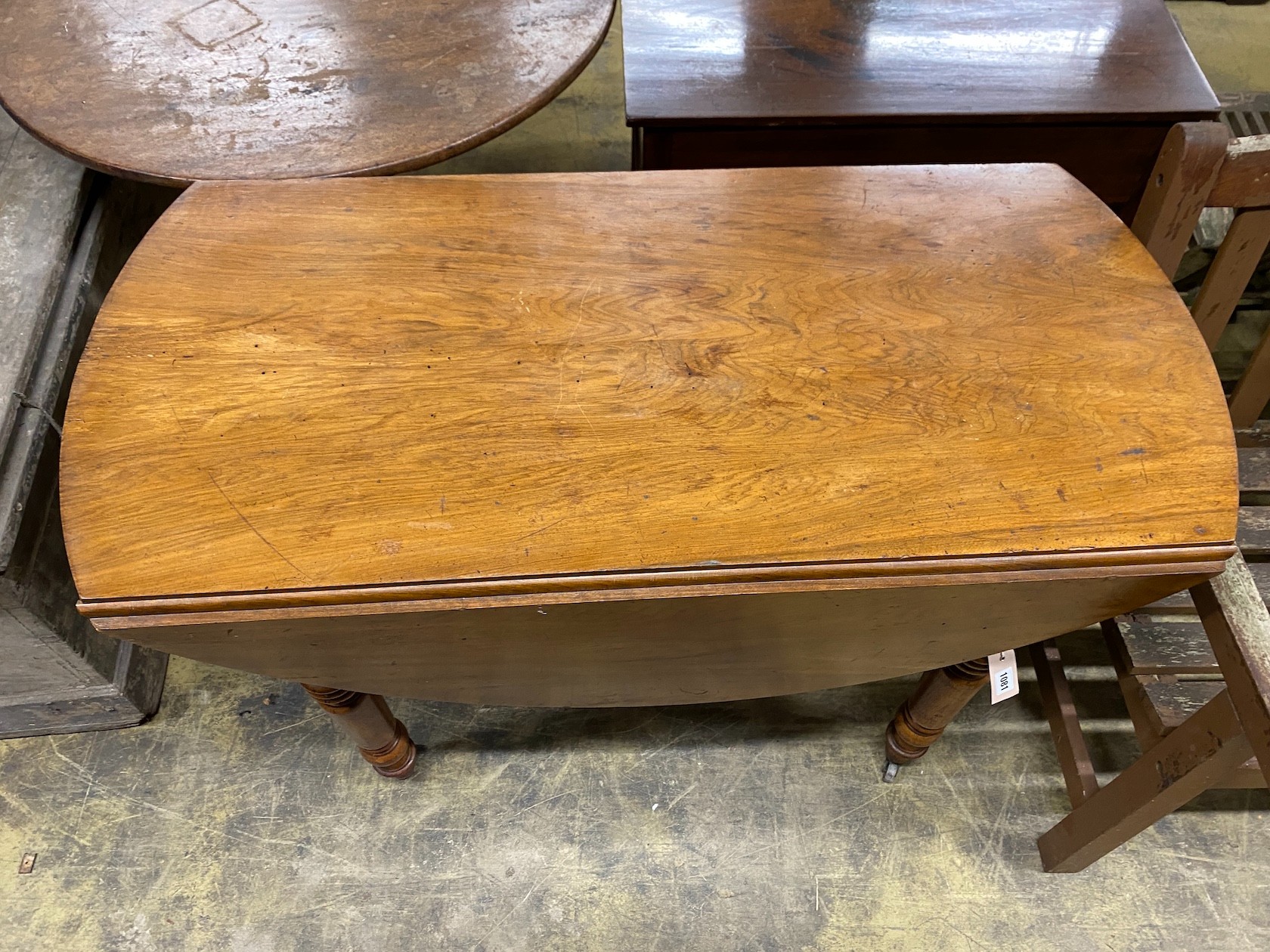 A 19th century French walnut drop flap table, width 110cm, depth 54cm, height 74cm